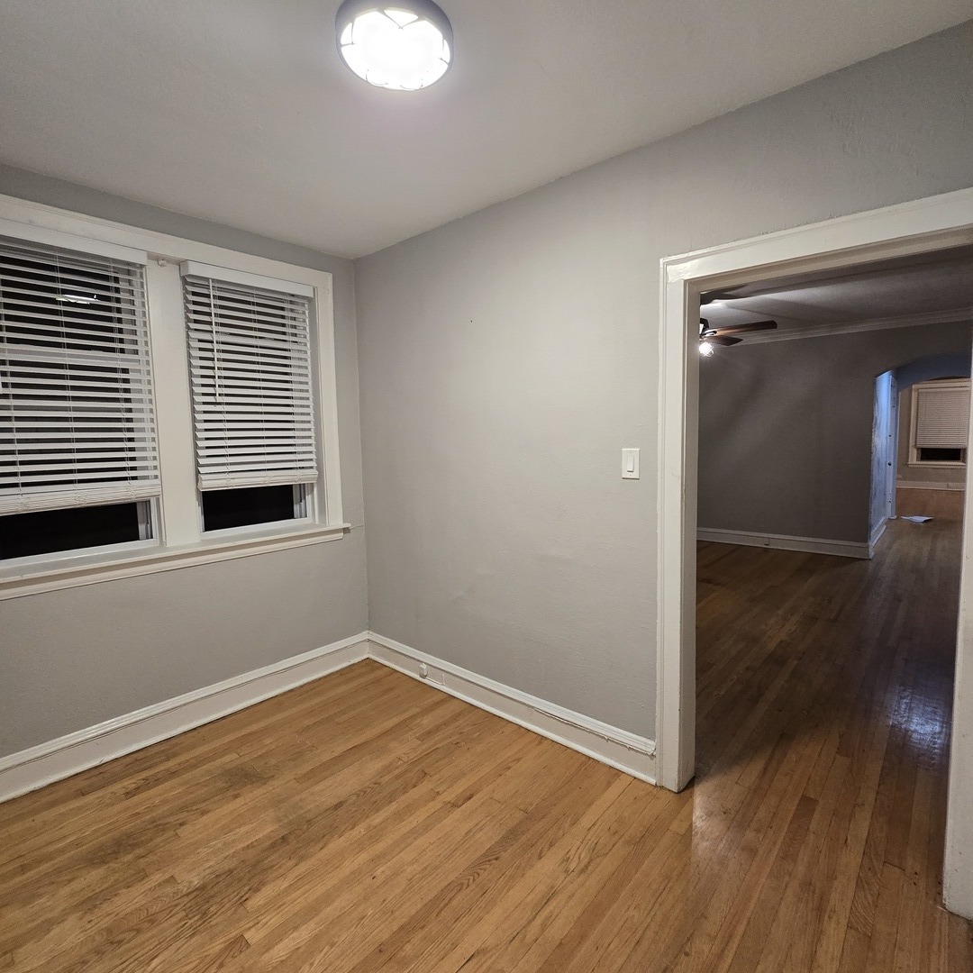 7529 North Claremont Avenue, Unit 2 Chicago, IL 60645 - Photo 16 of 24 a view of a room with wooden floor and window