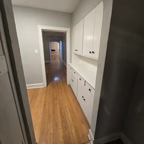 view of a hallway view with wooden floor