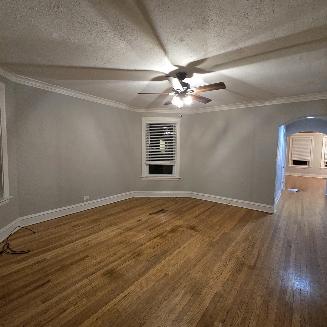 7529 North Claremont Avenue, Unit 2 Chicago, IL 60645 - Photo 18 of 24 wooden floor in an empty room with a window