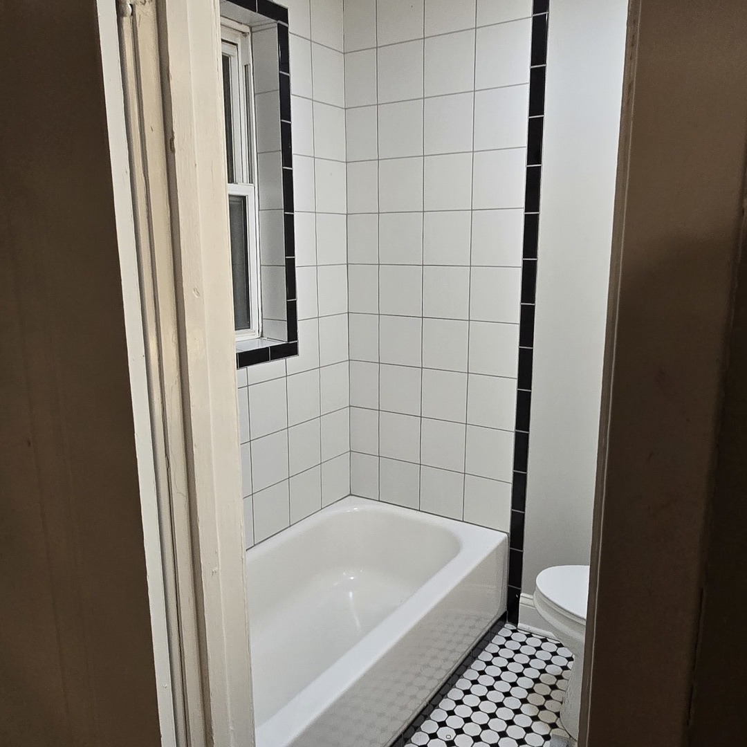 7529 North Claremont Avenue, Unit 2 Chicago, IL 60645 - Photo 24 of 24 a bathroom with a bathtub and a shower