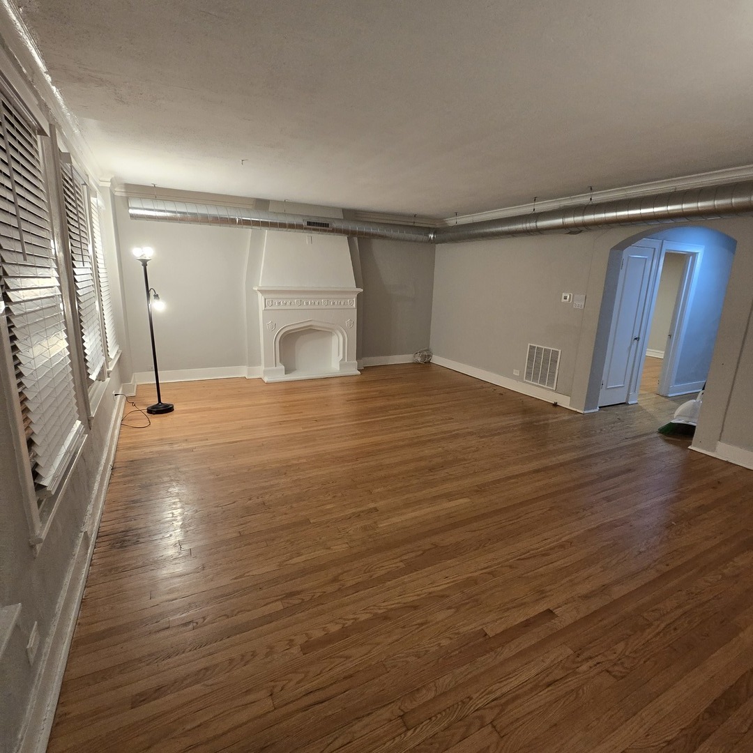 7529 North Claremont Avenue, Unit 2 Chicago, IL 60645 - Photo 3 of 24 a view of empty room with wooden floor