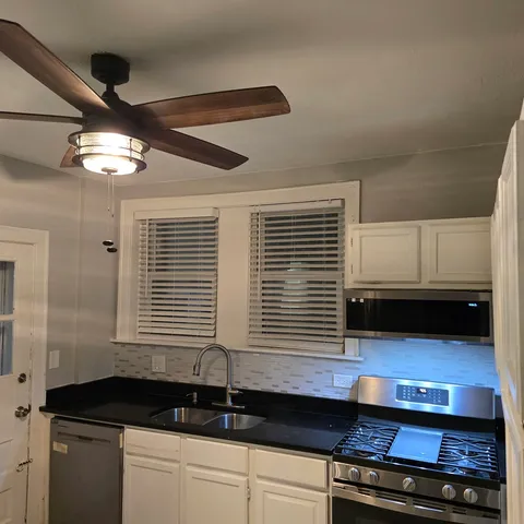 a kitchen with a large center island and a stove