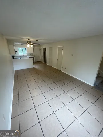 a kitchen with stainless steel appliances granite countertop a refrigerator and a stove