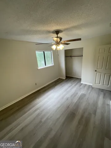 a bathroom with a toilet sink and shower