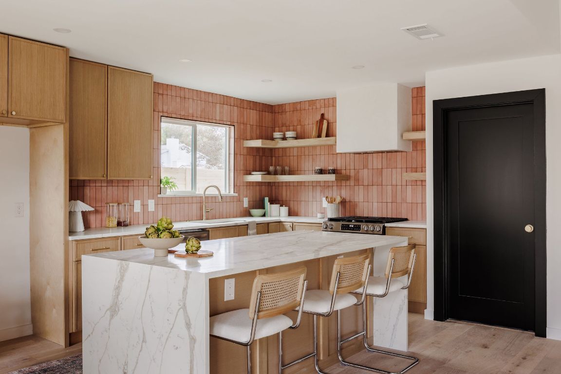 2009 Lear Lane Austin, TX 78745 - Photo 6 of 38 Cobalt quartz countertops w/ amazing waterfall island, gorgeous claytile backsplash.