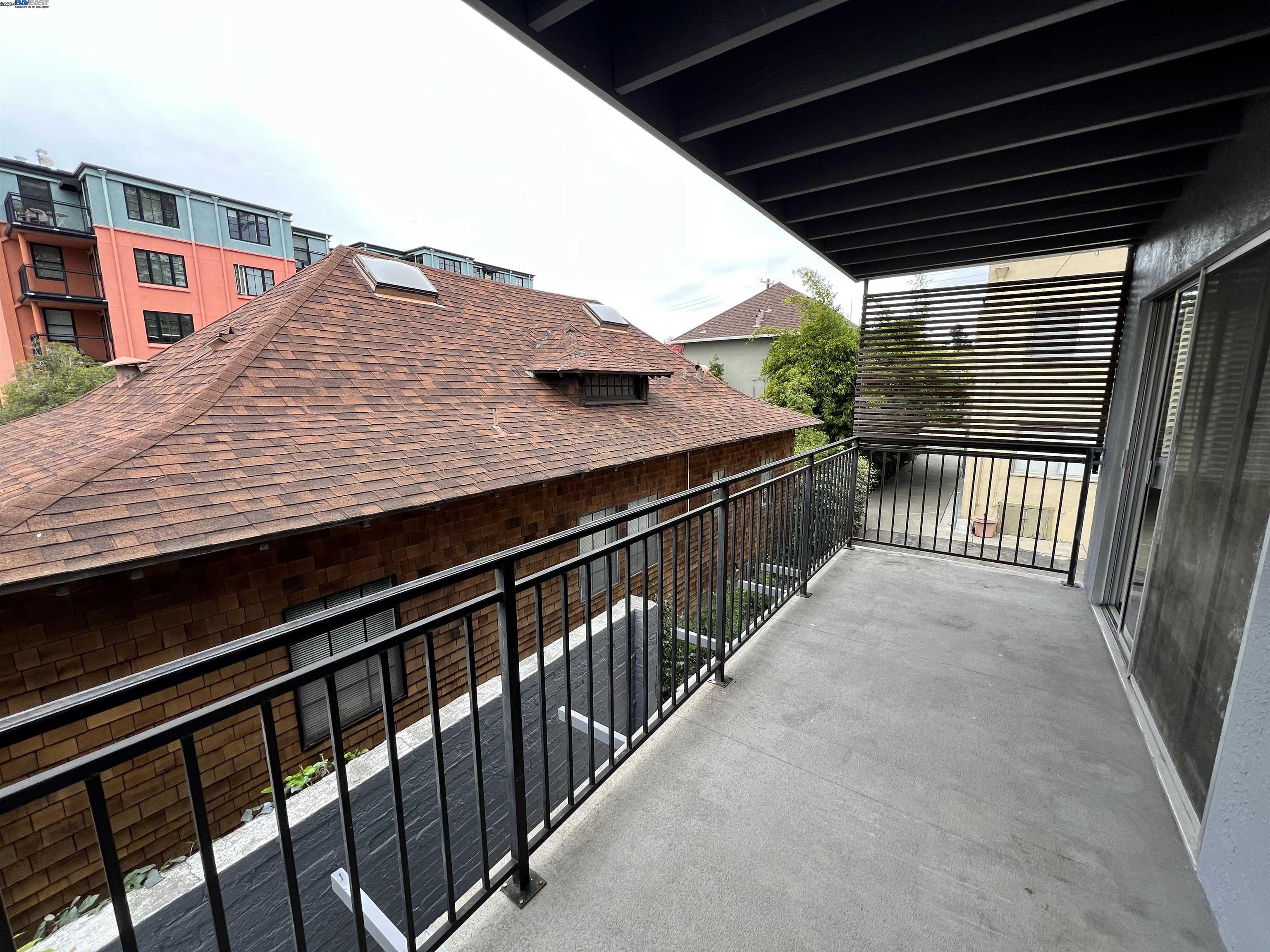 2418 Ashby Avenue, Unit B Berkeley, CA 94705 - Photo 5 of 17 a view of balcony with wooden floor and fence
