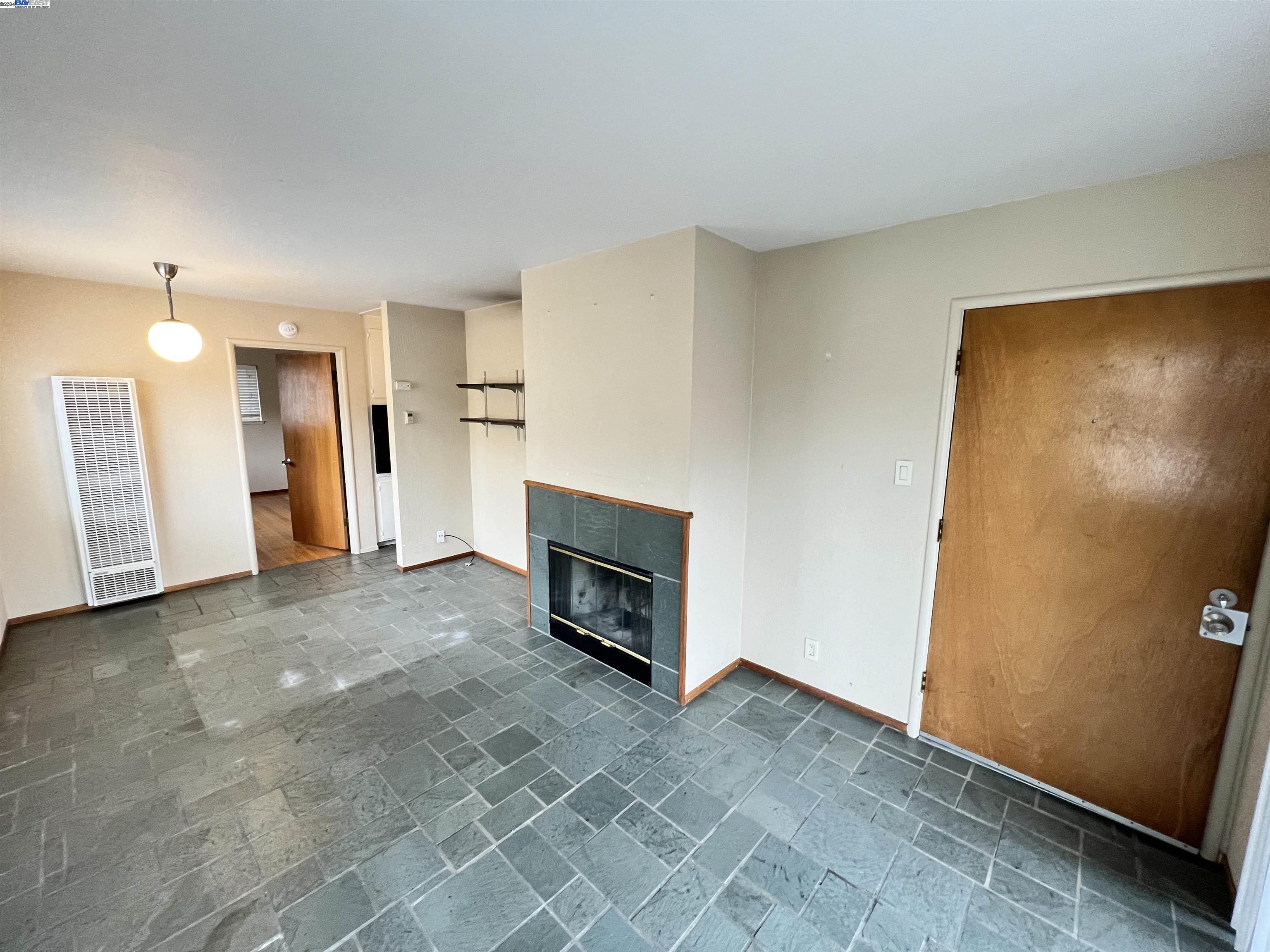 2418 Ashby Avenue, Unit B Berkeley, CA 94705 - Photo 9 of 17 a view of a livingroom with a fireplace