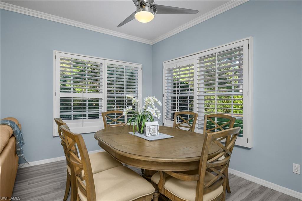 963 Egrets Run, Unit 102 Naples, FL 34108 - Photo 11 of 39 a view of a dining room with furniture window and outside view