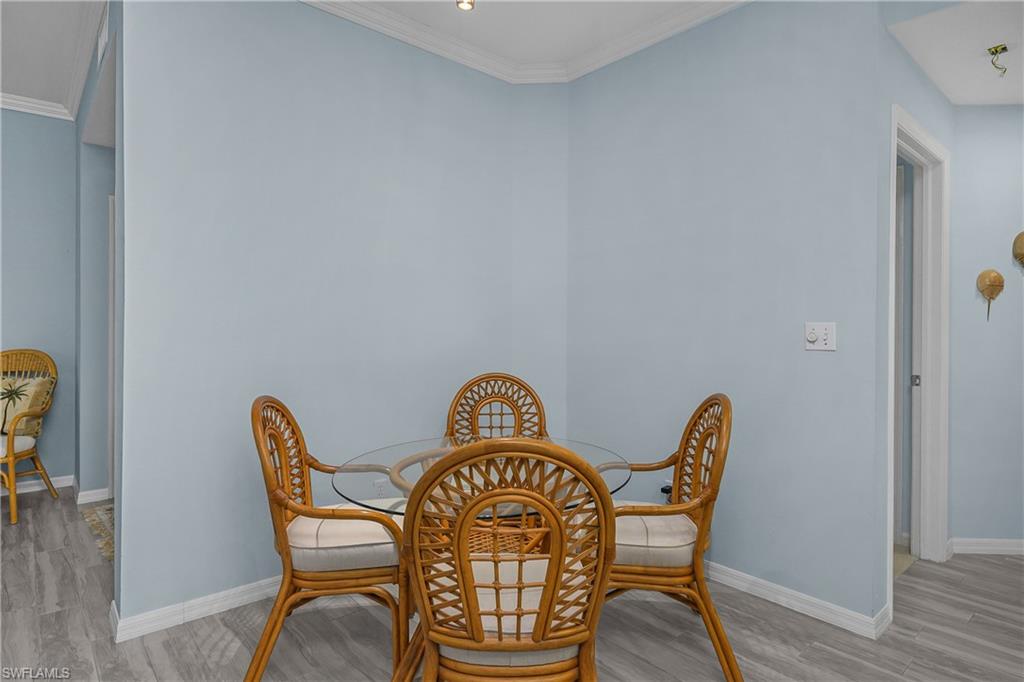 963 Egrets Run, Unit 102 Naples, FL 34108 - Photo 16 of 39 a view of a chairs in a room