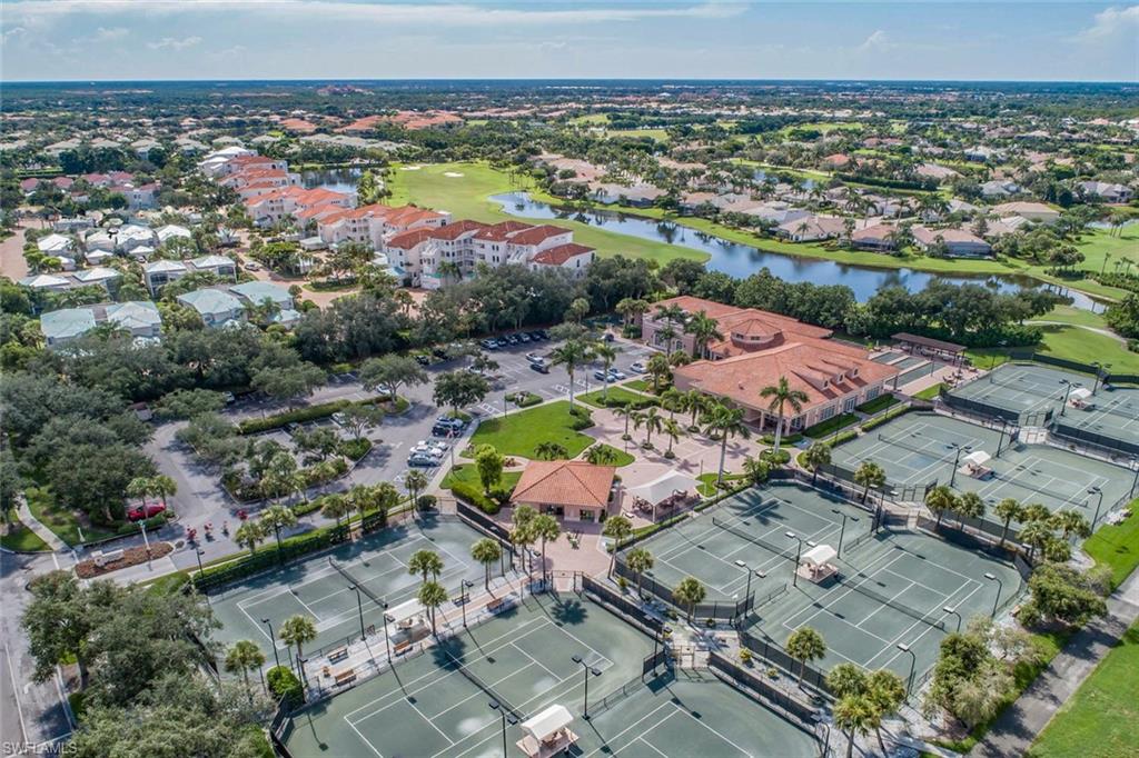 963 Egrets Run, Unit 102 Naples, FL 34108 - Photo 29 of 39 an aerial view of residential houses with outdoor space