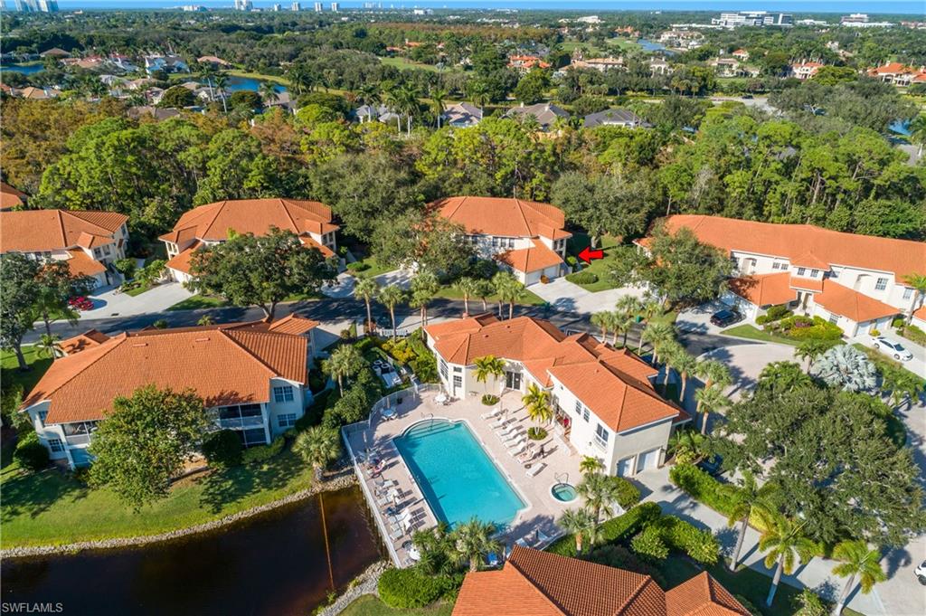 963 Egrets Run, Unit 102 Naples, FL 34108 - Photo 3 of 39 an aerial view of residential houses with outdoor space