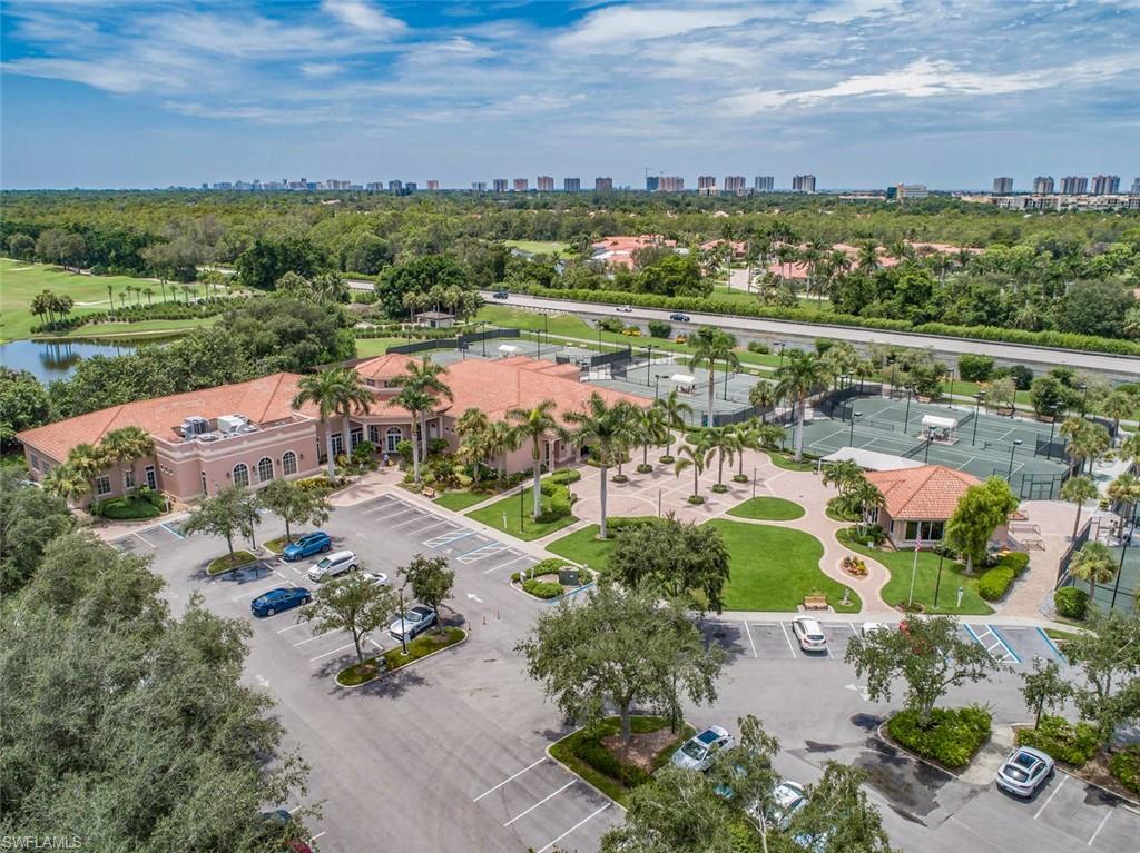 963 Egrets Run, Unit 102 Naples, FL 34108 - Photo 31 of 39 an aerial view of a city with lots of residential buildings ocean and mountain view in back