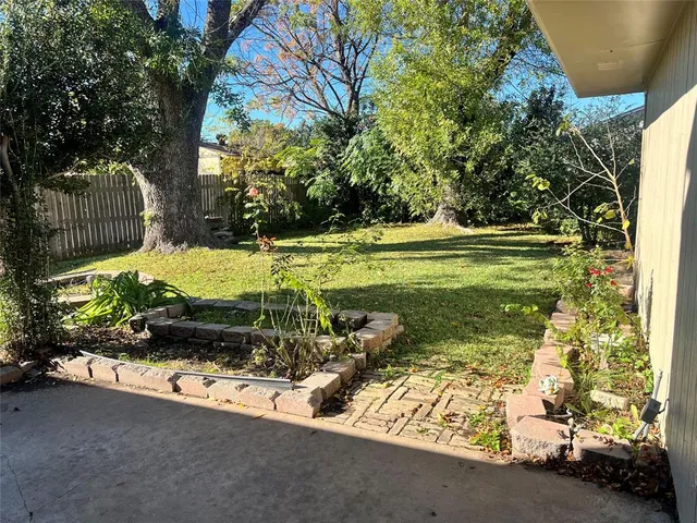 a view of a bench in front of a yard