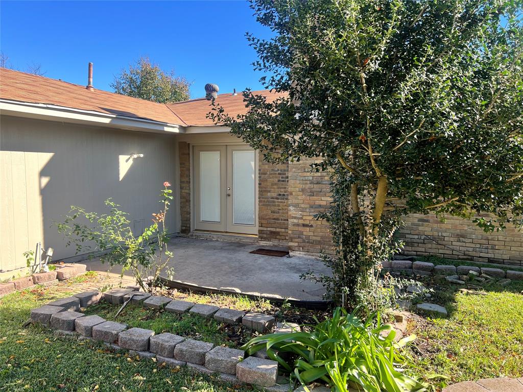 2021 Mill Pond Road Garland, TX 75044 - Photo 19 of 20 a view of a house with a yard