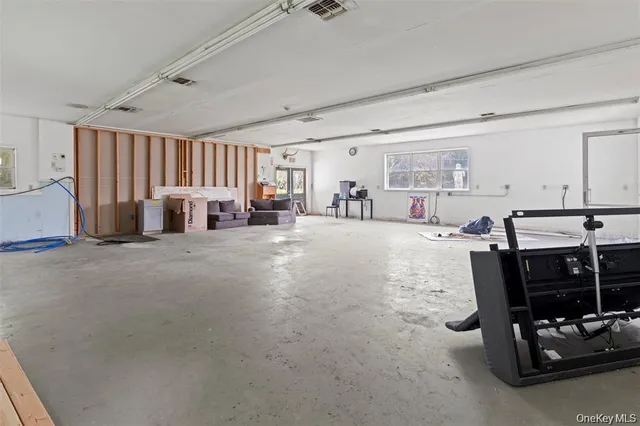 a view of a livingroom with furniture and window