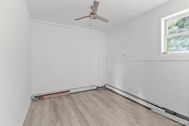 a bathroom with a bathtub a sink and a window