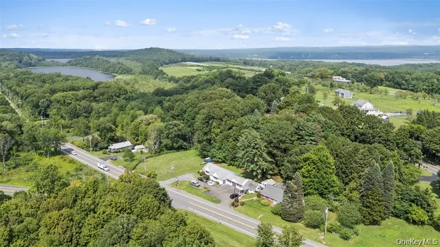 an aerial view of a house with yard swimming pool and outdoor seating
