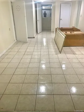 a kitchen with a table chairs and a refrigerator