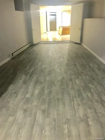 a kitchen with a refrigerator sink and cabinets