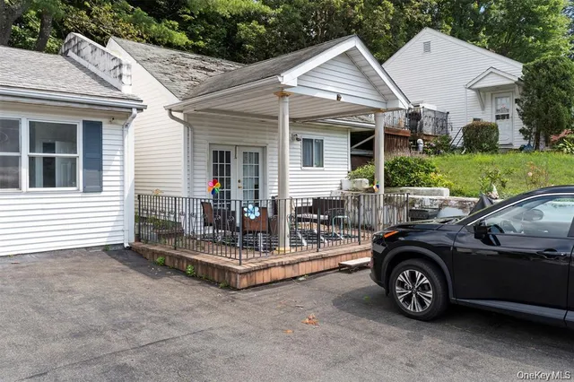 a view of a car parked in front of house