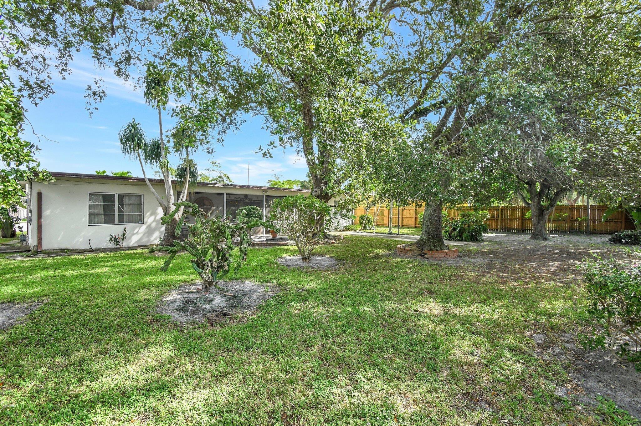 65 Northwest 12th Avenue Boca Raton, FL 33486 - Photo 1 of 47 Large Fenced Yard