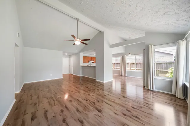 a view of livingroom with hardwood floor and a ceiling fan