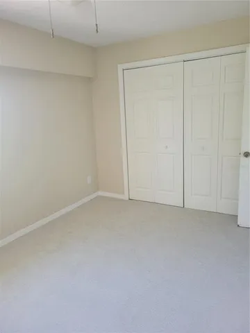 a kitchen with a sink a refrigerator and window
