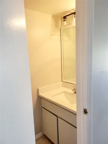 a bathroom with a shower and a sink