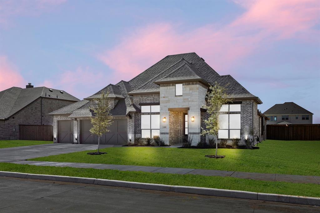 610 Tenor Drive Forney, TX 75126 - Photo 29 of 30 a front view of a house with a yard