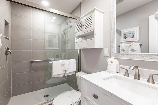 a bathroom with a shower and a sink