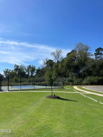 a view of a backyard with sitting area