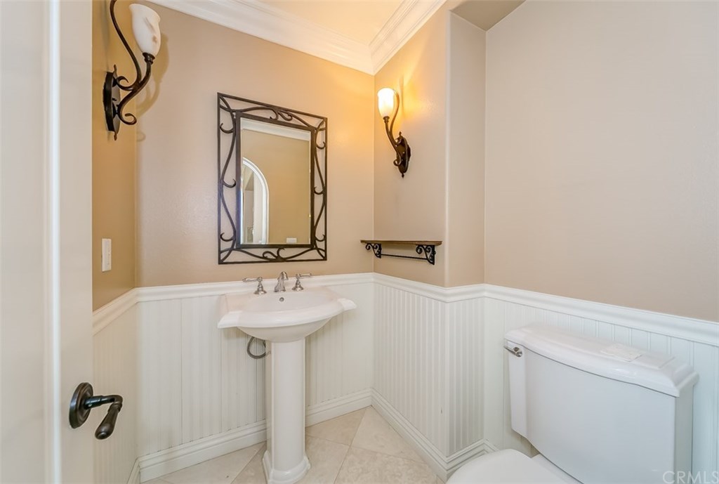 31 Climbing Vine Irvine, CA 92603 - Photo 14 of 20 a bathroom with a sink and mirror with toilet