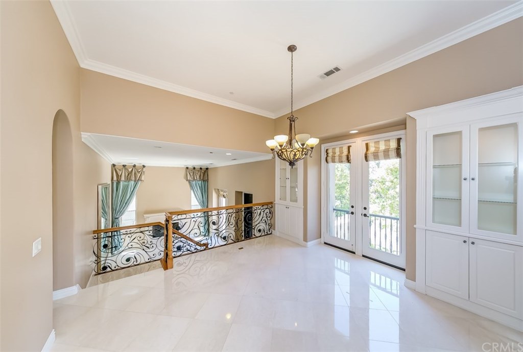 31 Climbing Vine Irvine, CA 92603 - Photo 5 of 20 a view of a livingroom with a chandelier fan and windows
