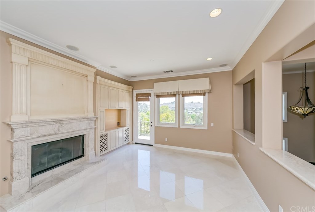 31 Climbing Vine Irvine, CA 92603 - Photo 6 of 20 a view of empty room with a fireplace
