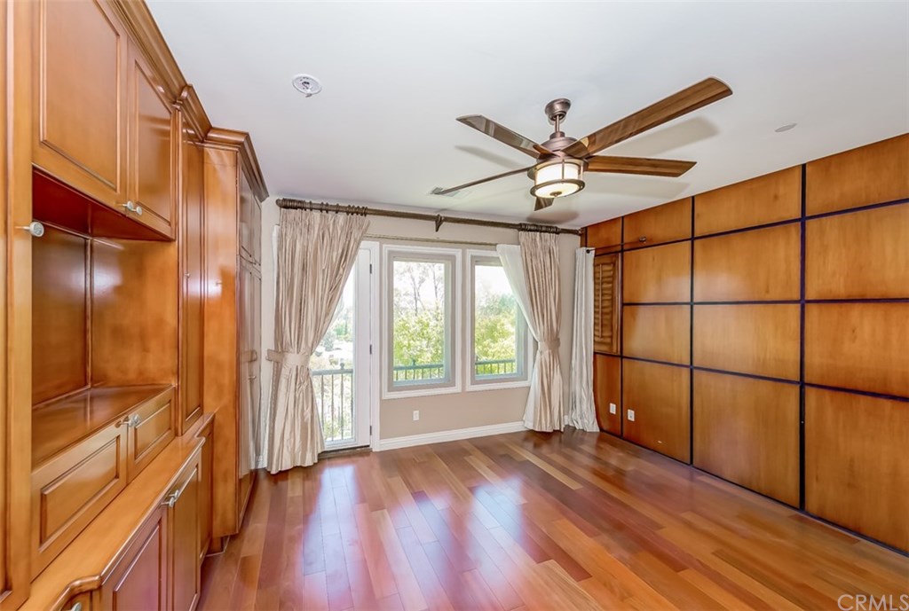 31 Climbing Vine Irvine, CA 92603 - Photo 9 of 20 a view of an empty room with a window and wooden floor