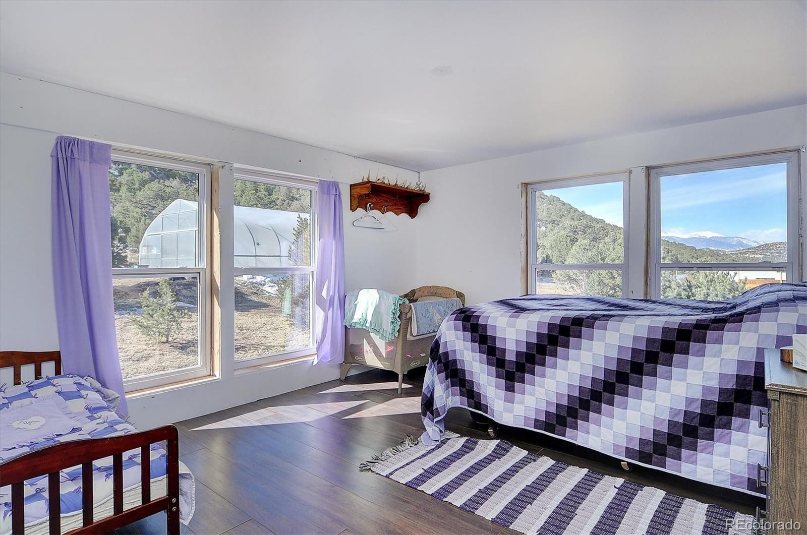 1700 Mitchell Mountain Road Westcliffe, CO 81252 - Photo 21 of 40 a living room with furniture and a window