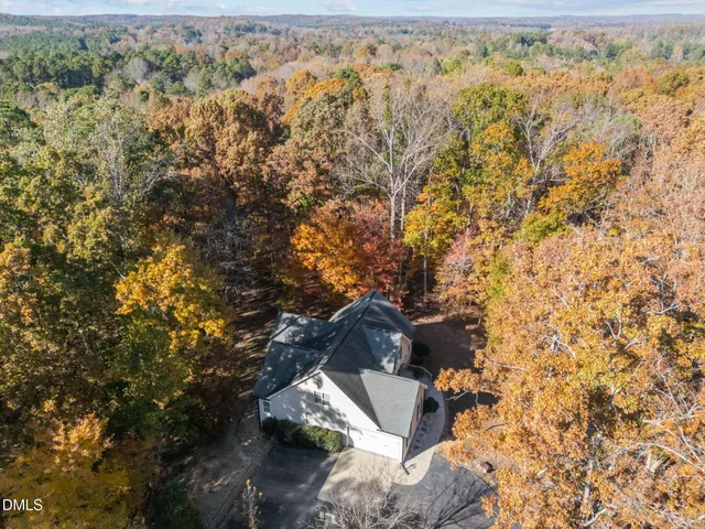an aerial view of residential house with outdoor space