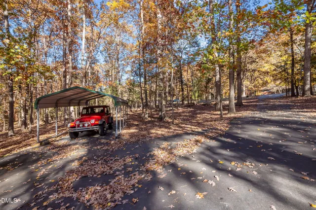 a view of street with cars and trees