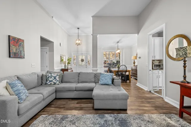 a living room with furniture or couch and a wooden floor