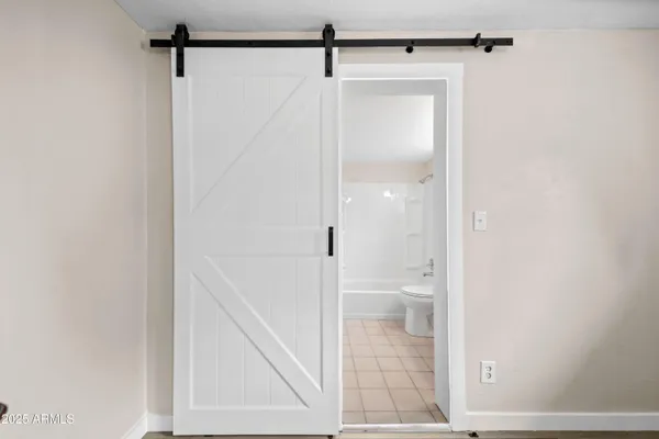 a bathroom with a glass shower door