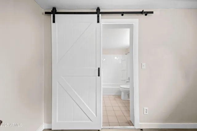 a bathroom with a glass shower door