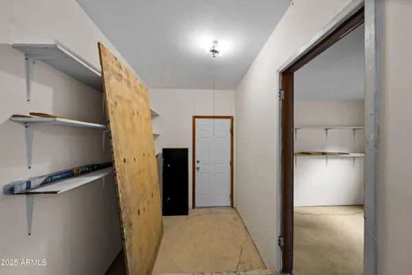 a view of hallway with shower