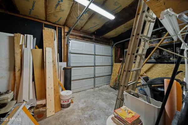 a view of walk in closet with wooden floor