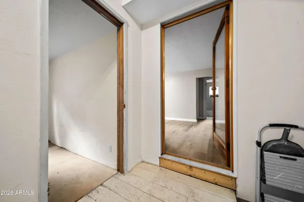 a view of a bathroom from a hallway