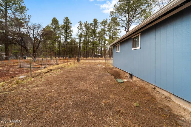 a backyard of a house with lots of green space