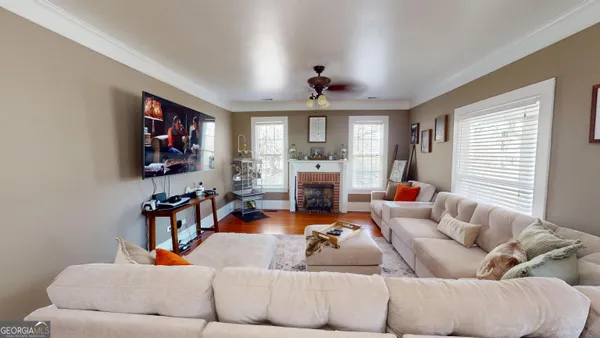 a view of a dining room with furniture window and wooden floor