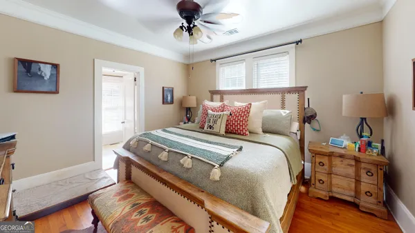 a living room with lots of furniture and a book shelf
