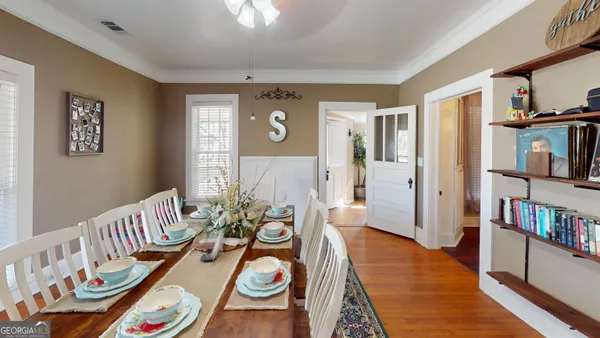 a view of a livingroom with furniture and hardwood floor