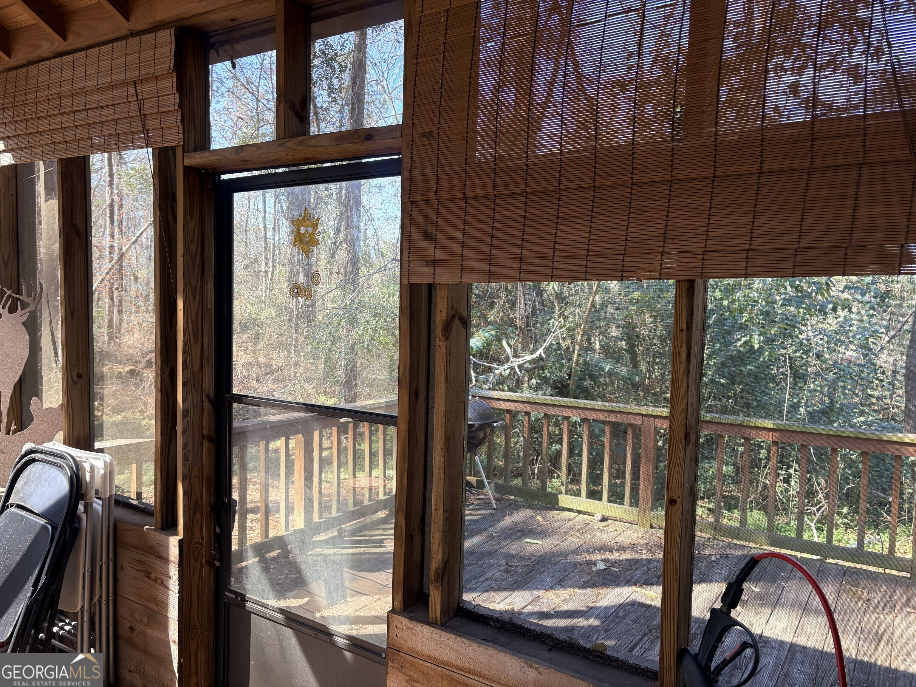 53 Summertown Main Street Midville, GA 30441 - Photo 46 of 57 a view of a balcony with a floor to ceiling window wooden floor