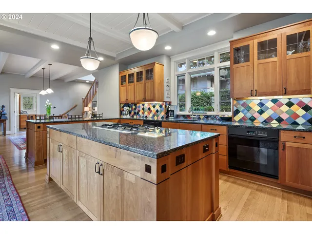a kitchen that has a lot of cabinets in it